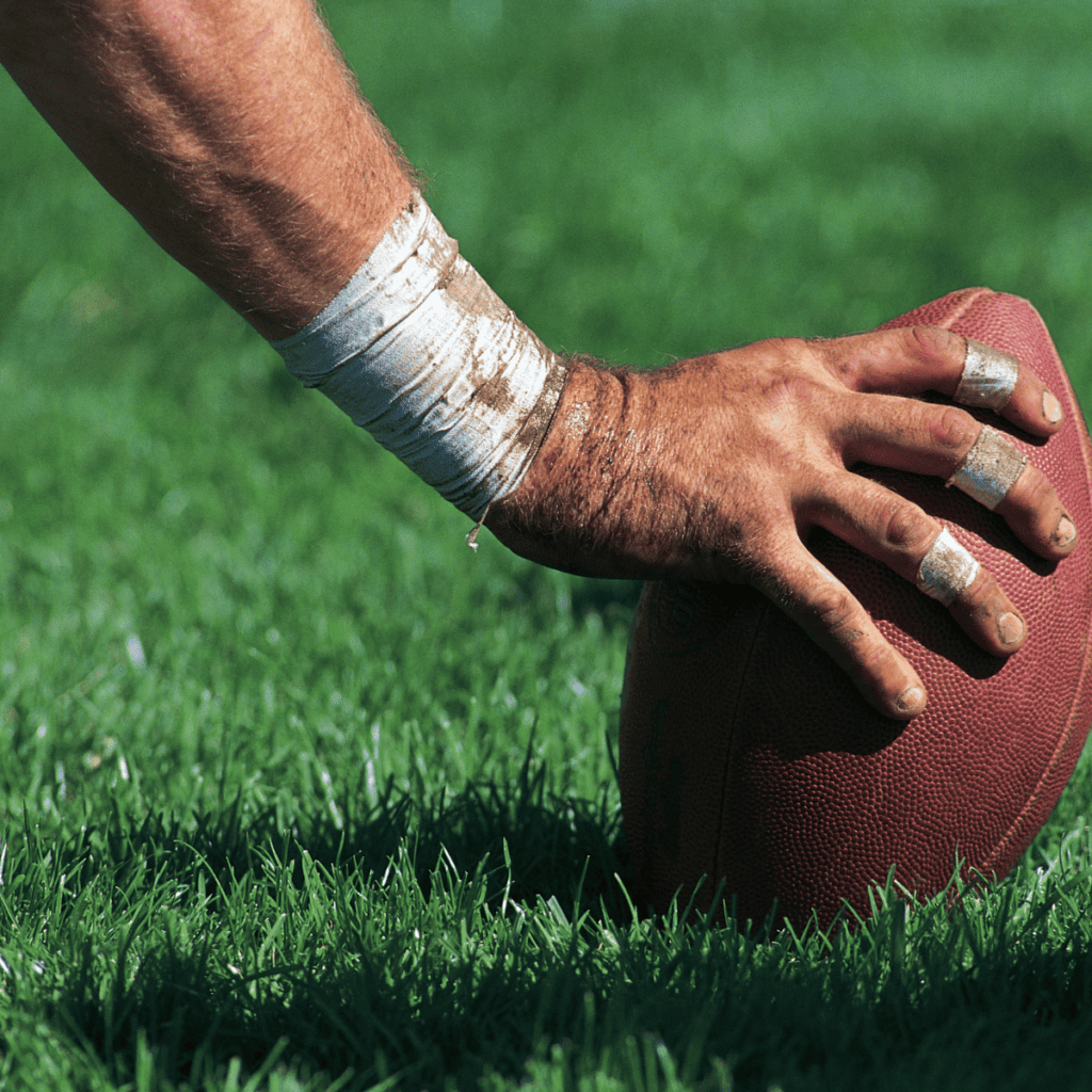 Center with Hand on Football